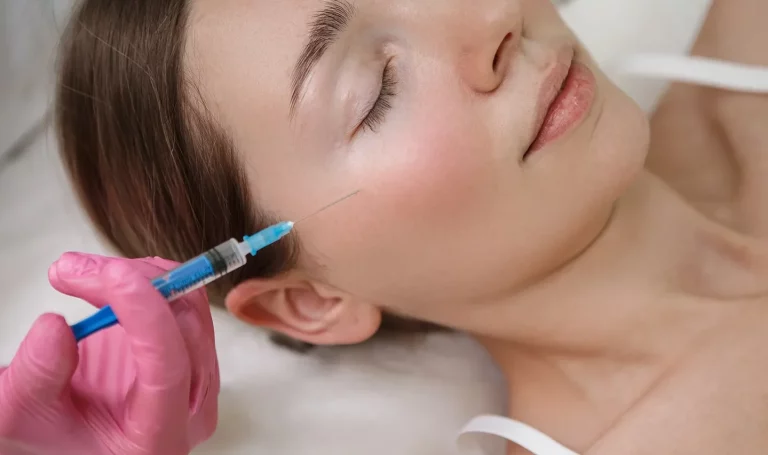 a portrait of a woman receiving dermal filler treatment