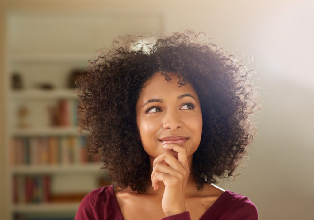 Shot of a thoughtful-looking young woman at home