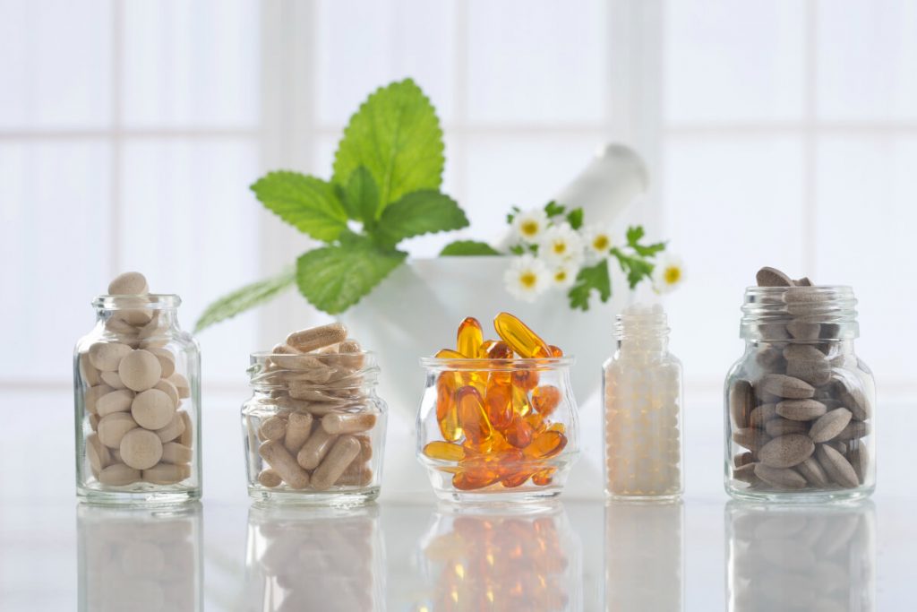 Hair Supplements in small glass bottles