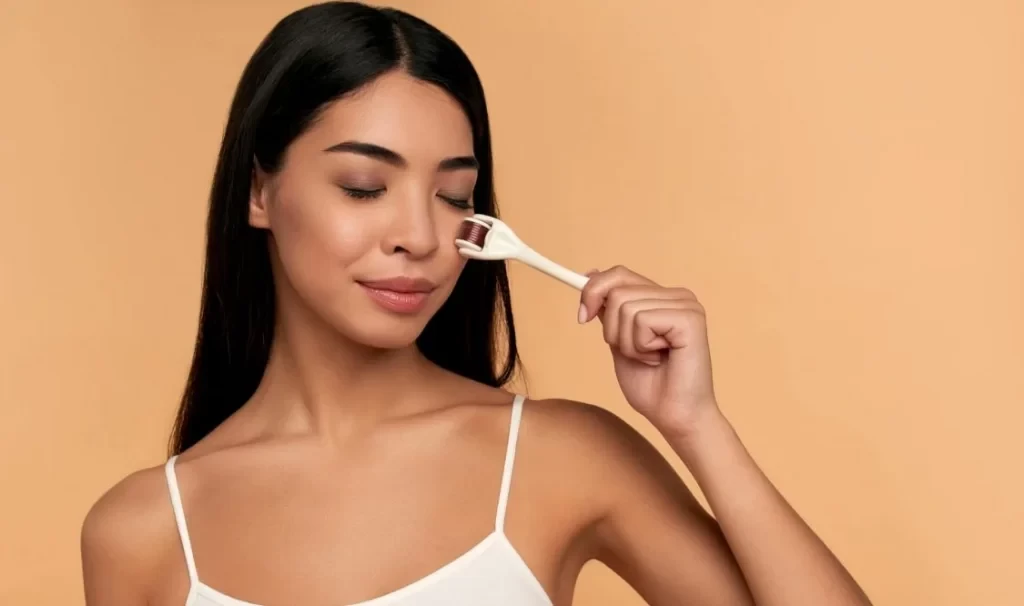 Close up of Asian female face with derma roller