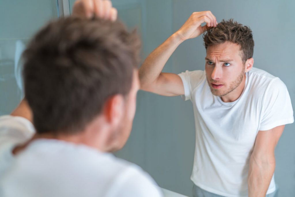 Man looking in the mirror