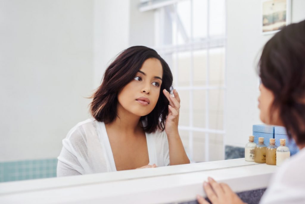 shot of an attractive young woman going through her morning beauty routine in the bathroom