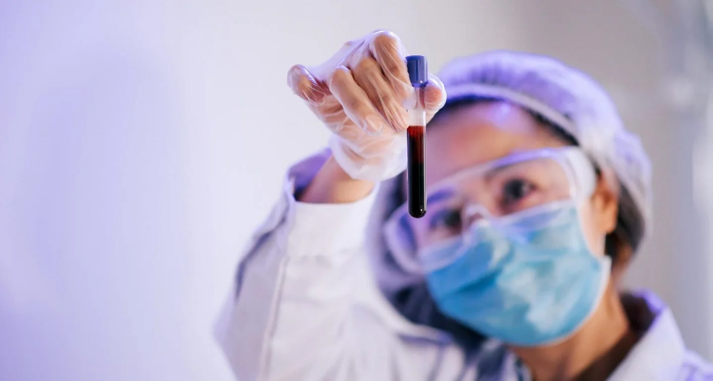 nurse holding the blood plasma in a tube