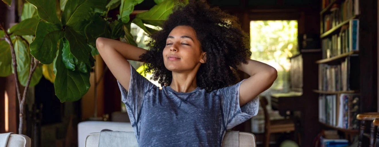 American woman enjoy some time in her house