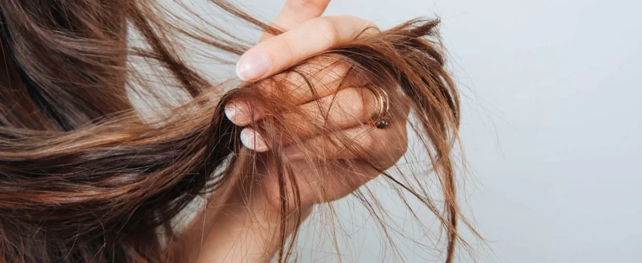 a girl holding her hair