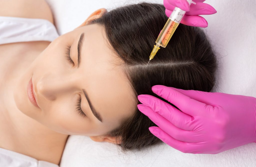 Cosmetologist does prp therapy of a beautiful woman