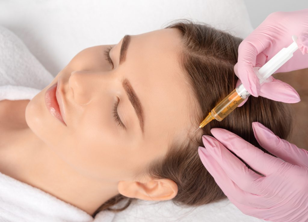 Cosmetologist does prp therapy against hair loss