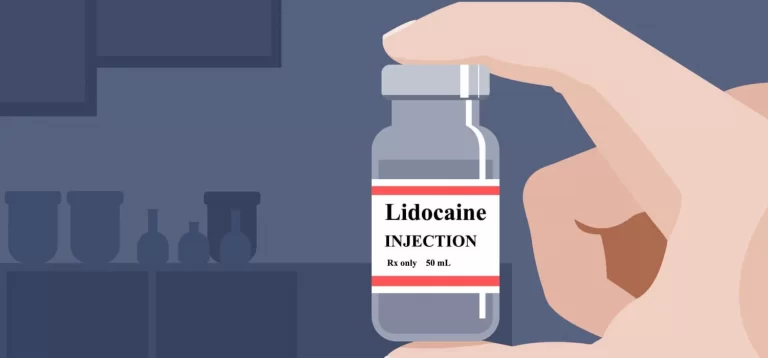 Lidocaine anesthetic drug. Hand holding a medicine vial.