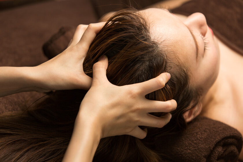 The woman has a head massage.