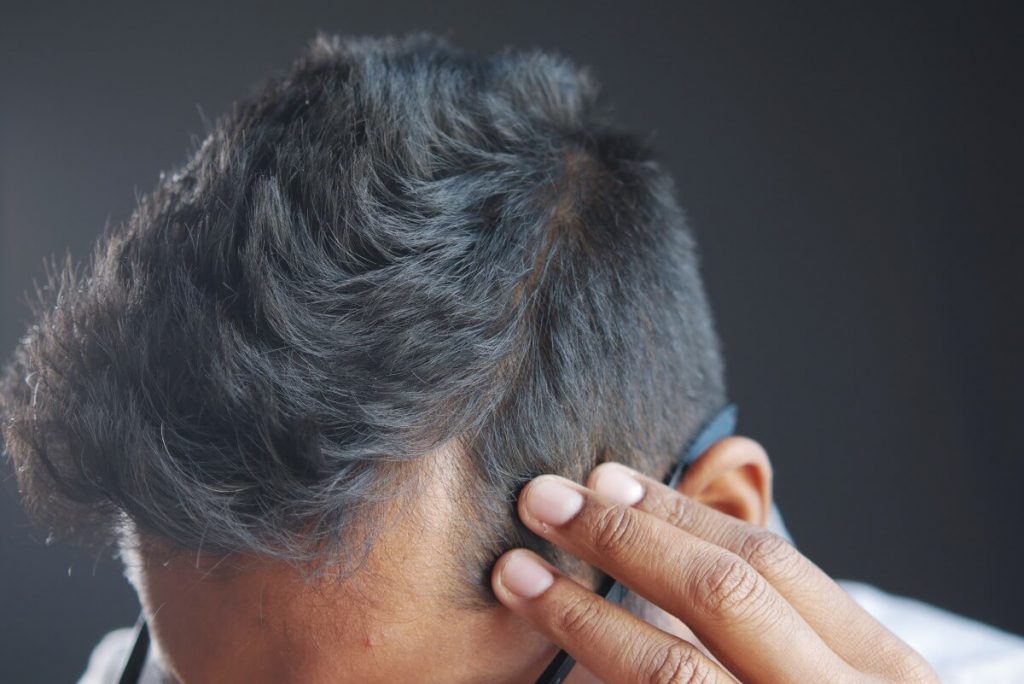 man checking his hair