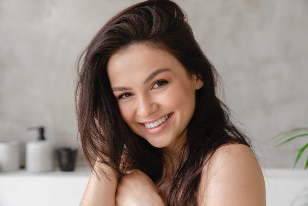 woman with shiny long brown straight hair