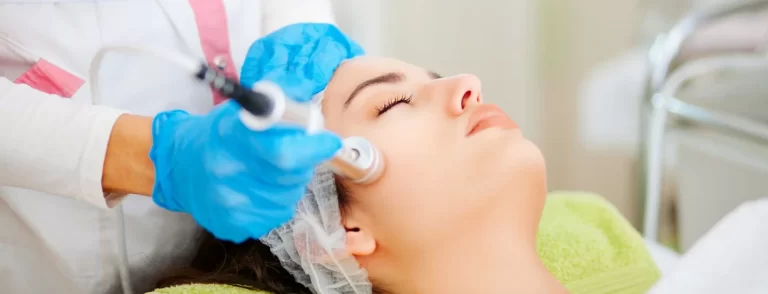 Woman's face receiving aesthetic treatment