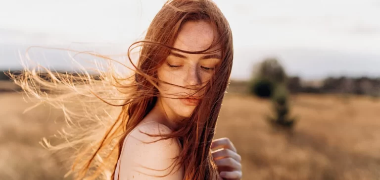 ginger woman with hair in the wind