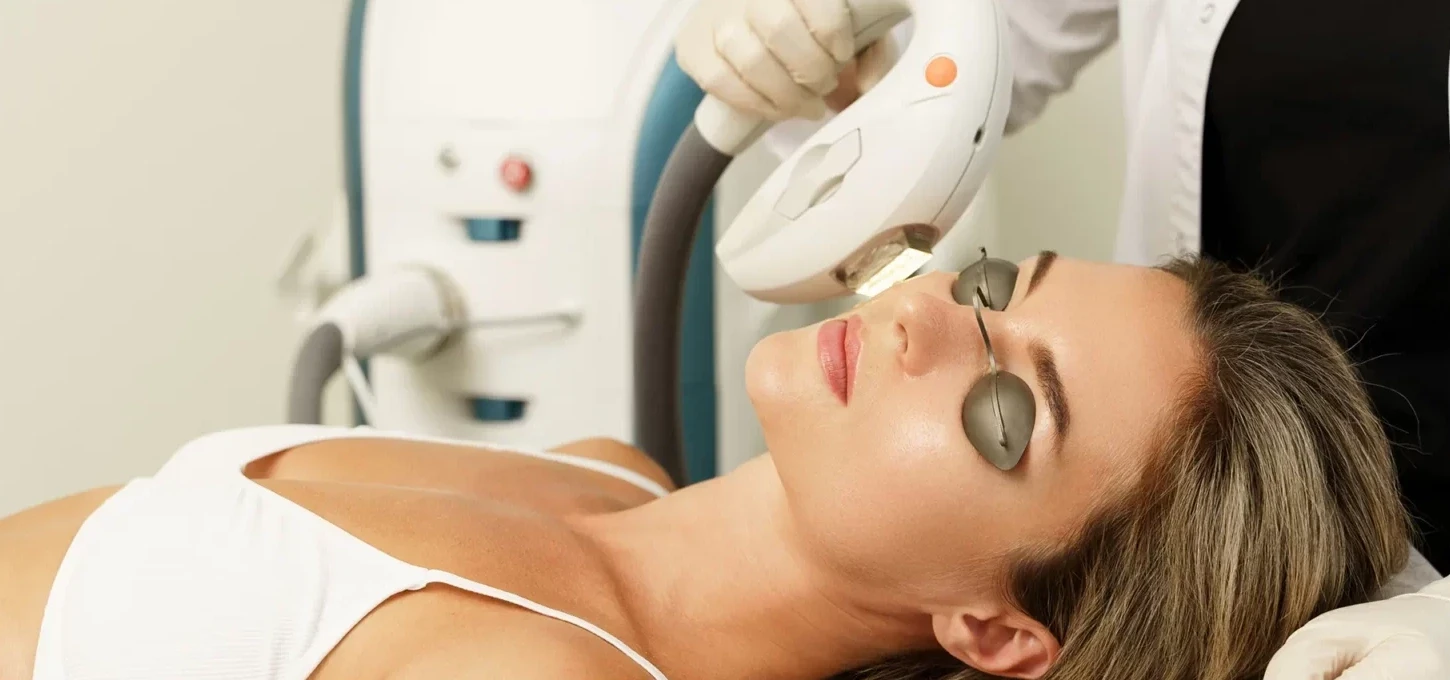 Woman client during IPL treatment in a cosmetology clinic.