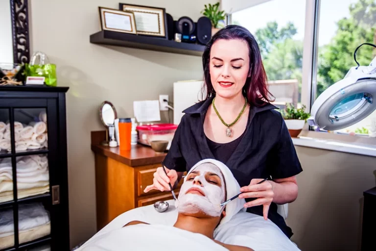 Woman Getting a Facial Mask Beauty Treatment at the Spa