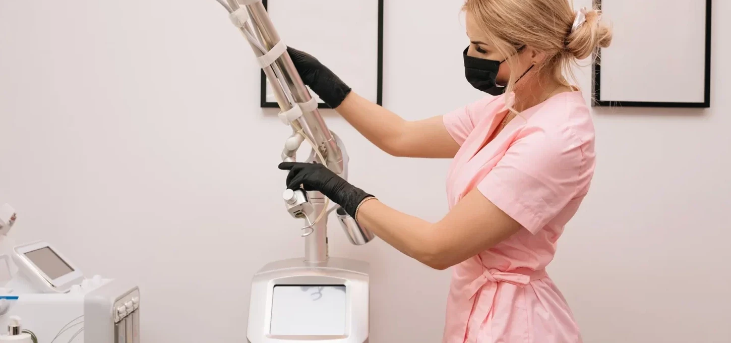 an aesthetician prepares for laser treatment procedure