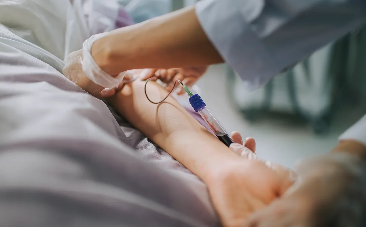 a medical provider uses butterfly needle for blood draw