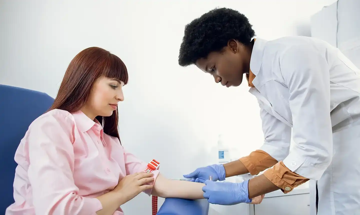 a medical provider uses butterfly needle for blood draw