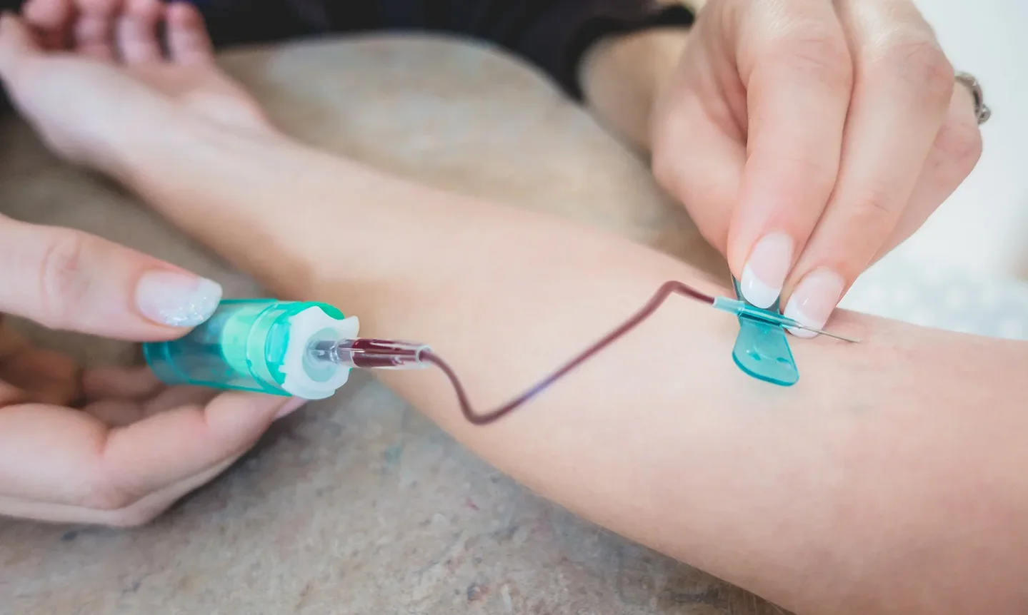 butterfly needle used in administering blood collection in a patient