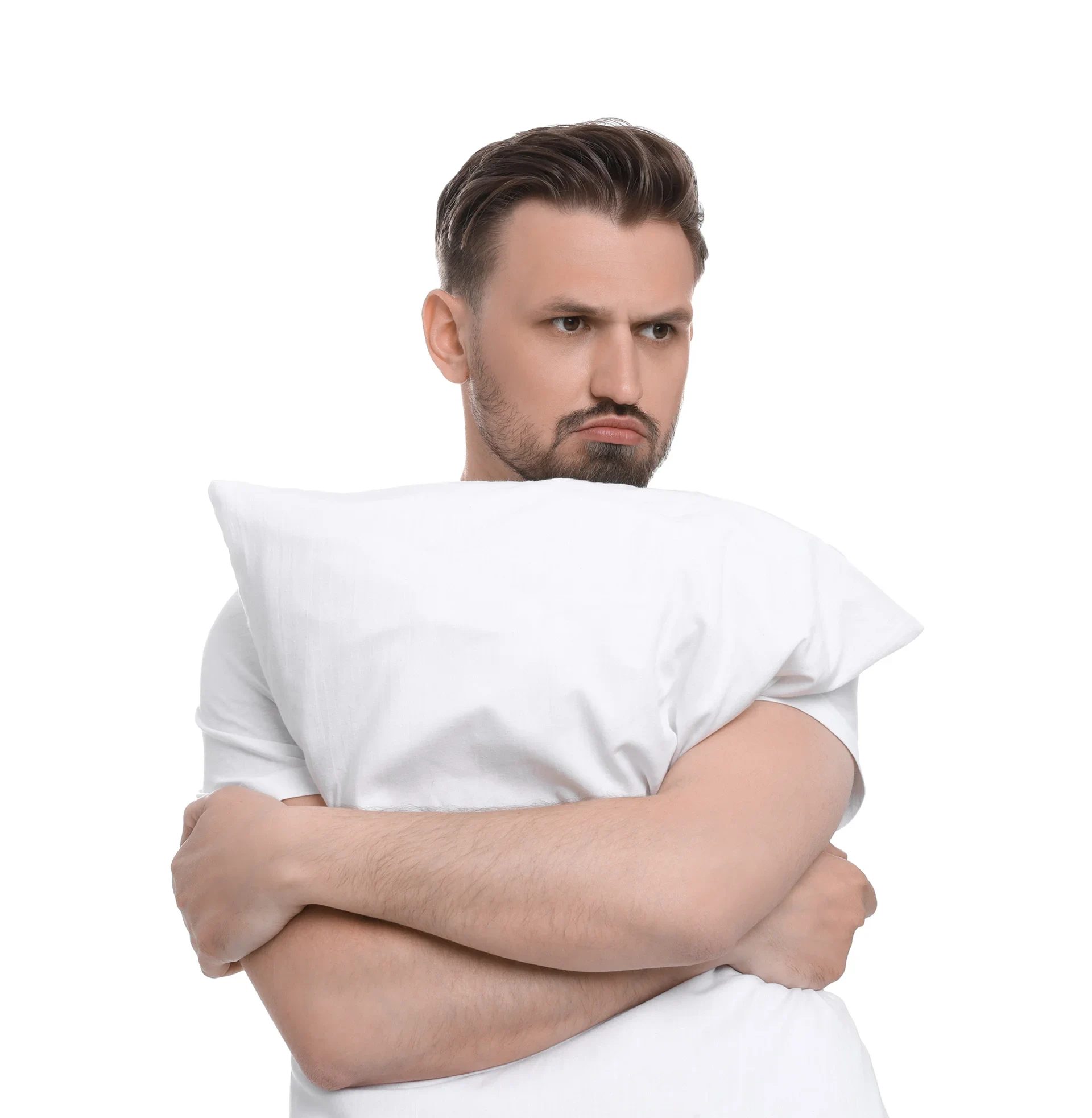 A man in white shirt hugging a pillow.