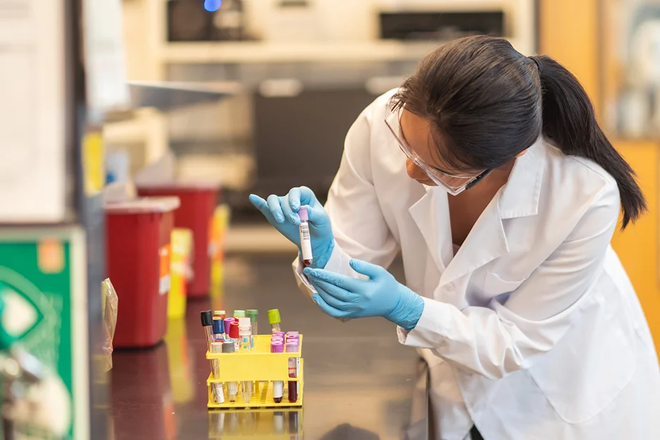 researcher conducts trials in a laboratory