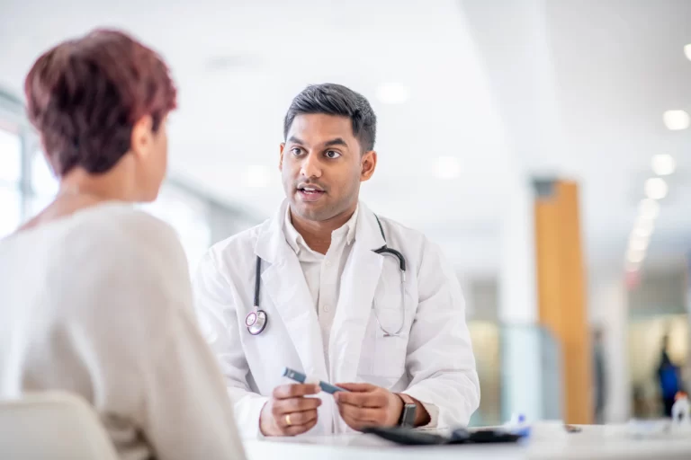 a patient consults her doctor with regards to diabetes treatments