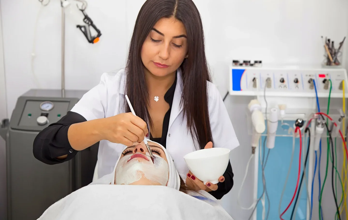 esthetician performs chemical peel procedure