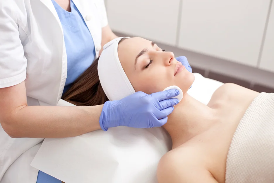 esthetician doing facial treatment