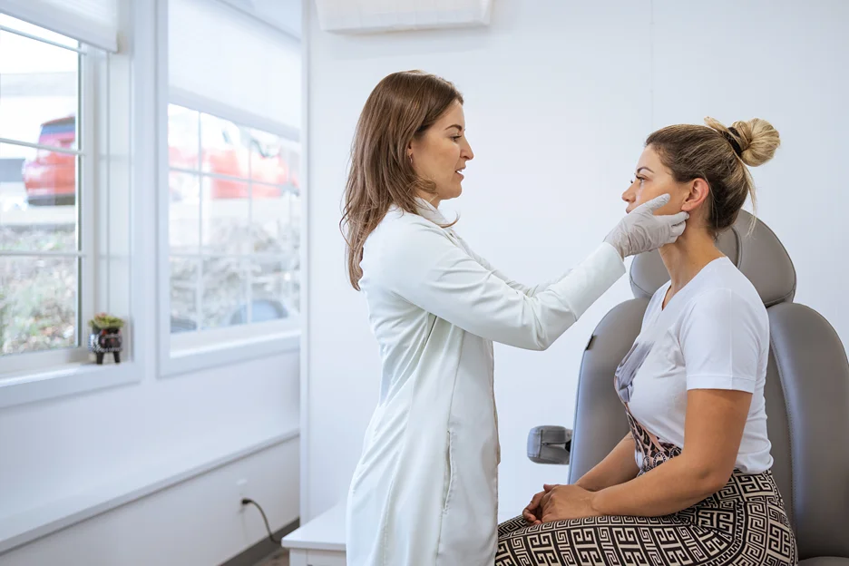 esthetician checking the client's facial anatomy