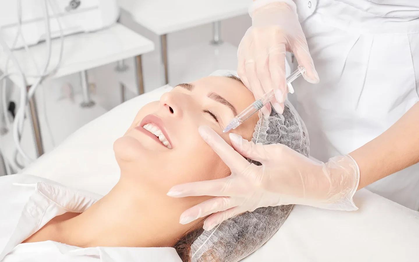 esthetician performs Botox injections on her client