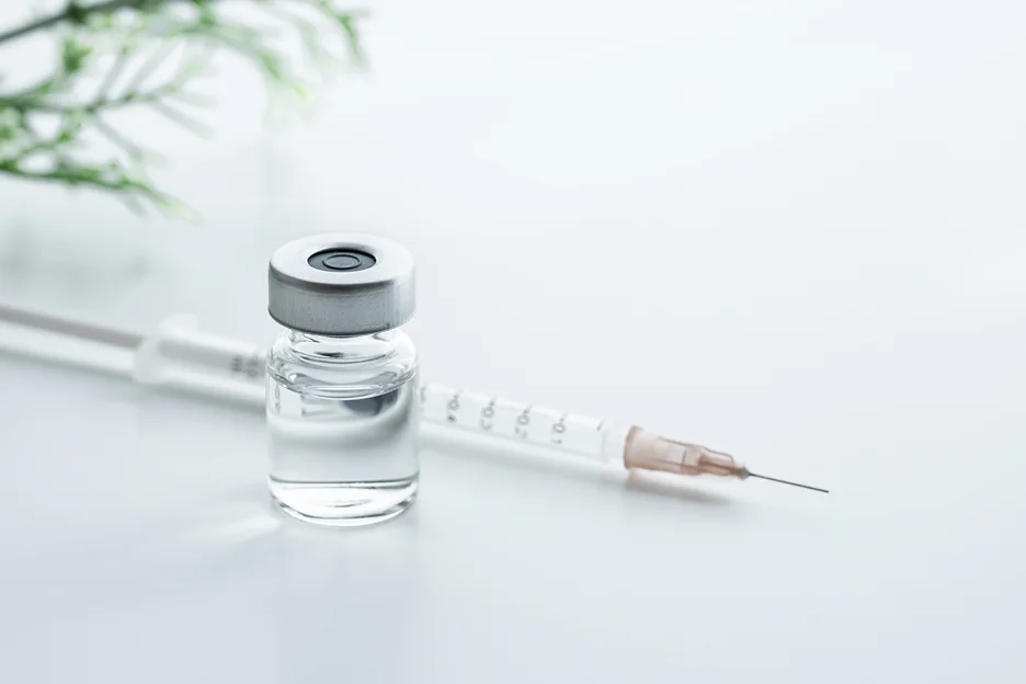 a vial of exosome and a syringe