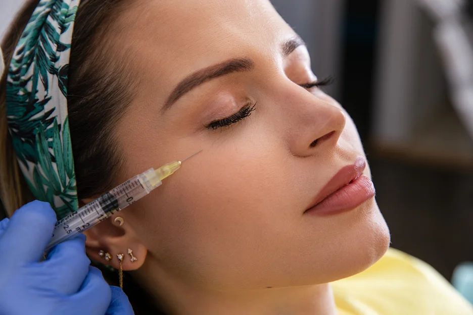 a medical professional injects exosome on the patient's tear trough