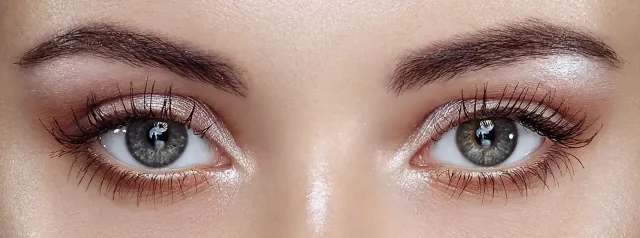 a portrait of a woman's bright eyes after using pdrn eye drop