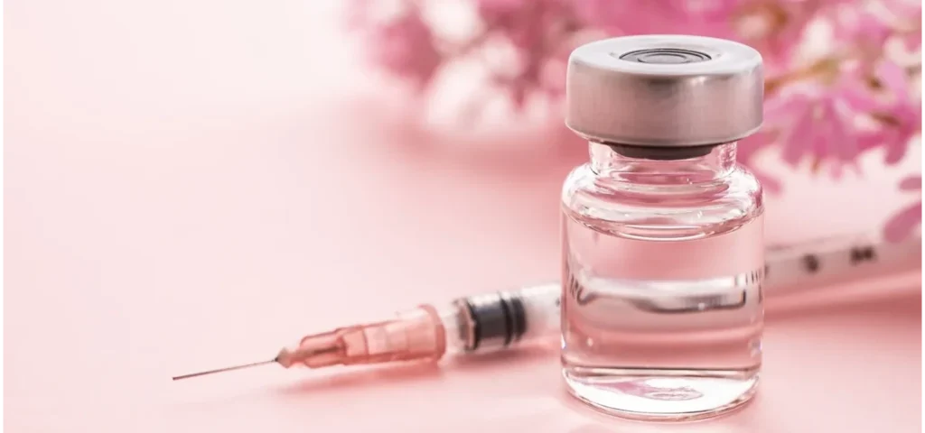 a vial of exosome and a syringe