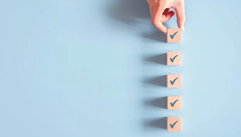 Wood cube with check mark on blue background