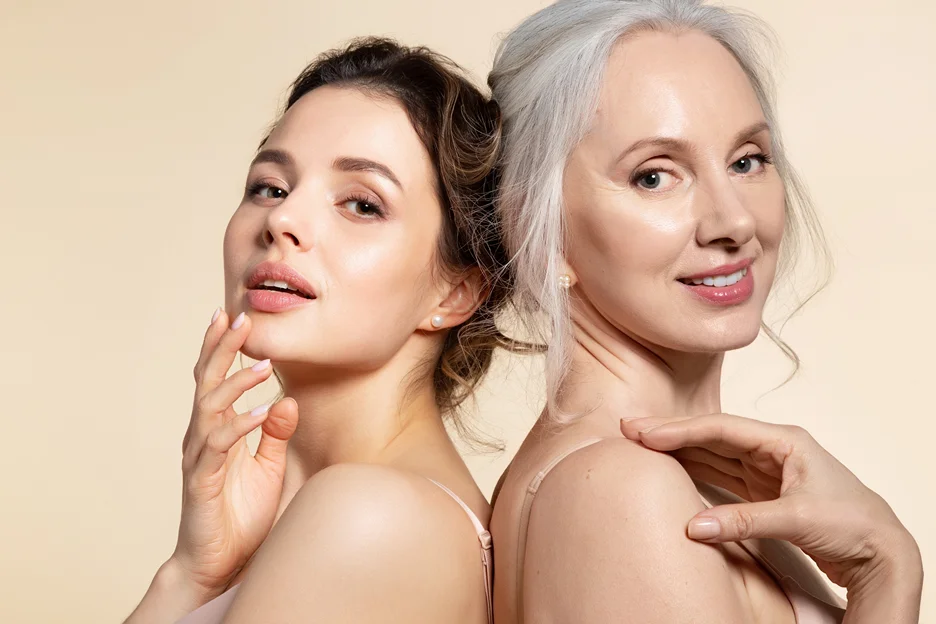 a portrait of a young woman and a middle-aged woman with glowing, youthful skin after pdrn booster treatment