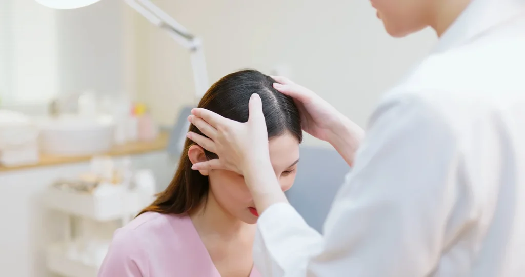 provider inspects patient's hair loss condition before polynucleotides treatment