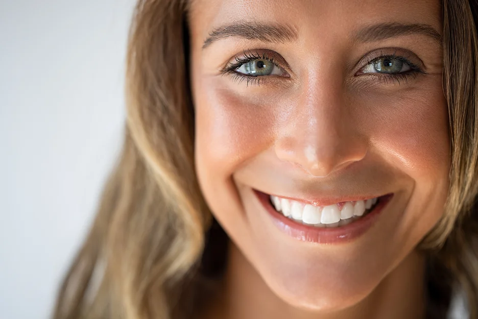 a portrait of a smiling, beautiful woman
