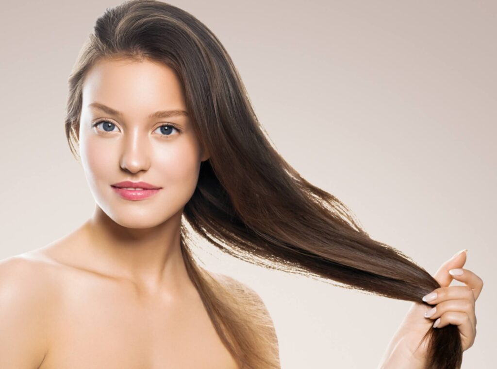 woman holing her hair after prp treatment