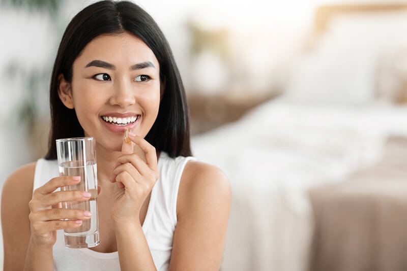woman taking medication after prp treatment
