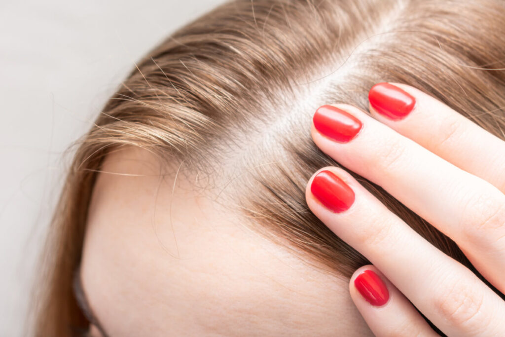 woman touching her hair